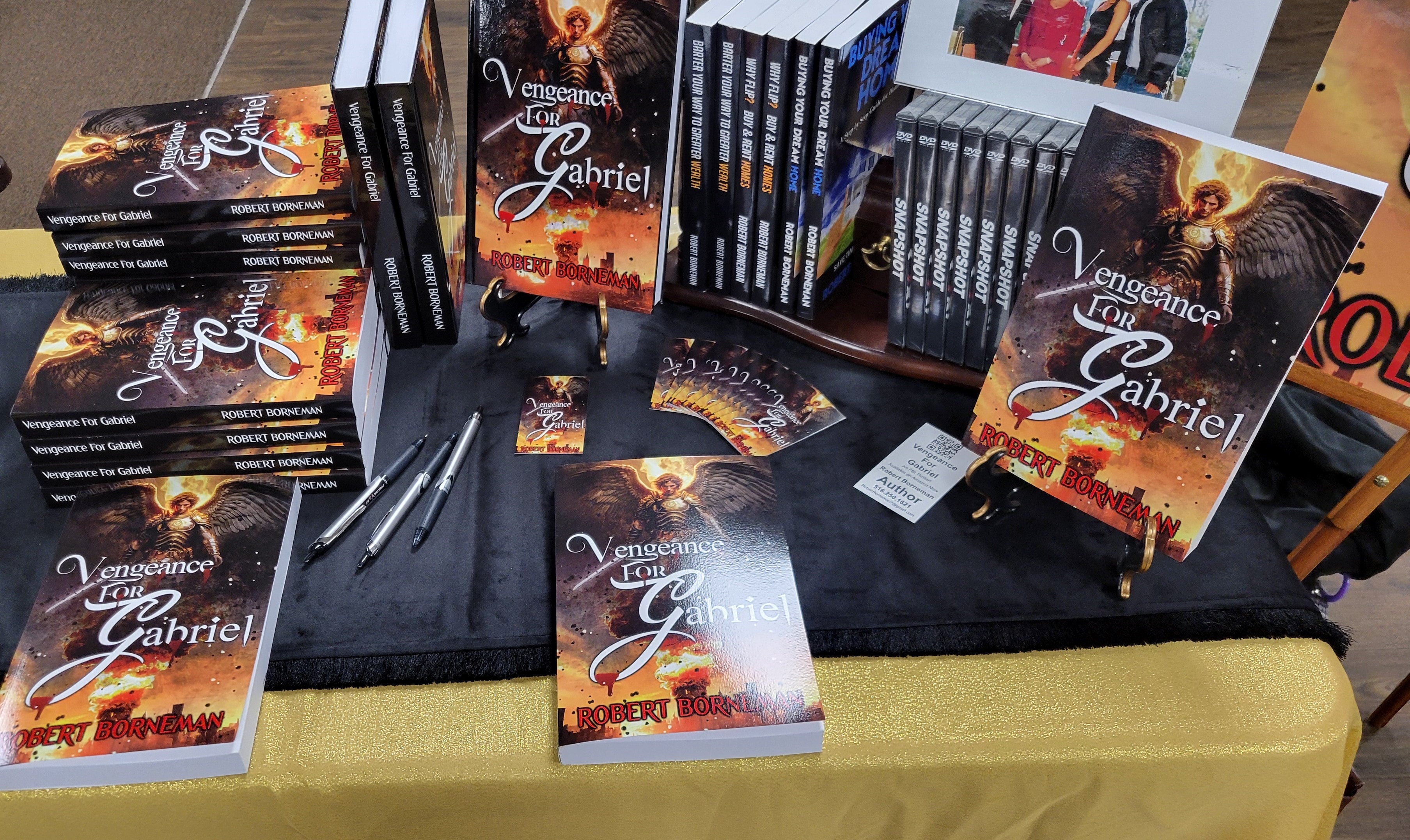 Book signing table display with Vengeance for Gabriel copies and merchandise