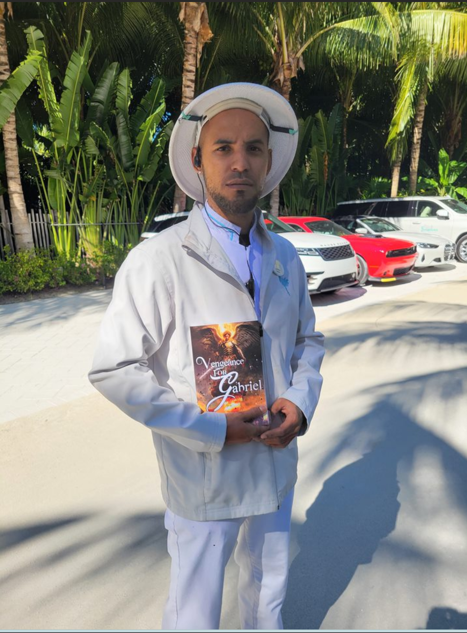 Reader holding Vengeance for Gabriel outdoors with palm trees