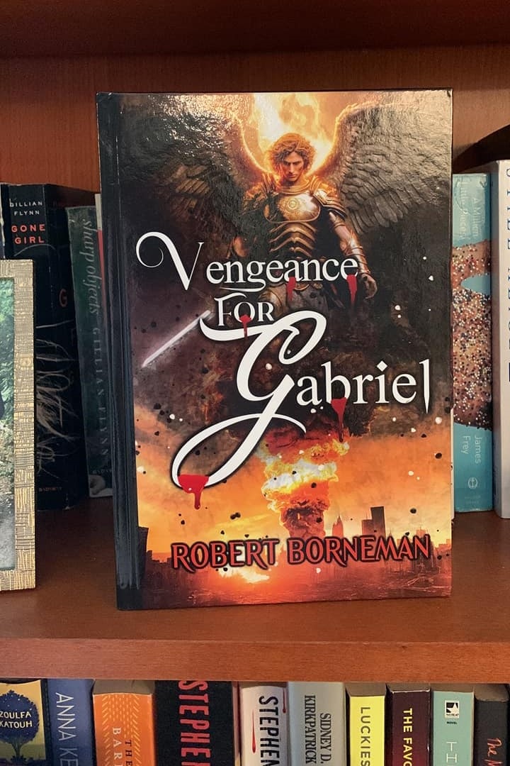 Mackenzie Gifford with Vengeance for Gabriel on a bookshelf