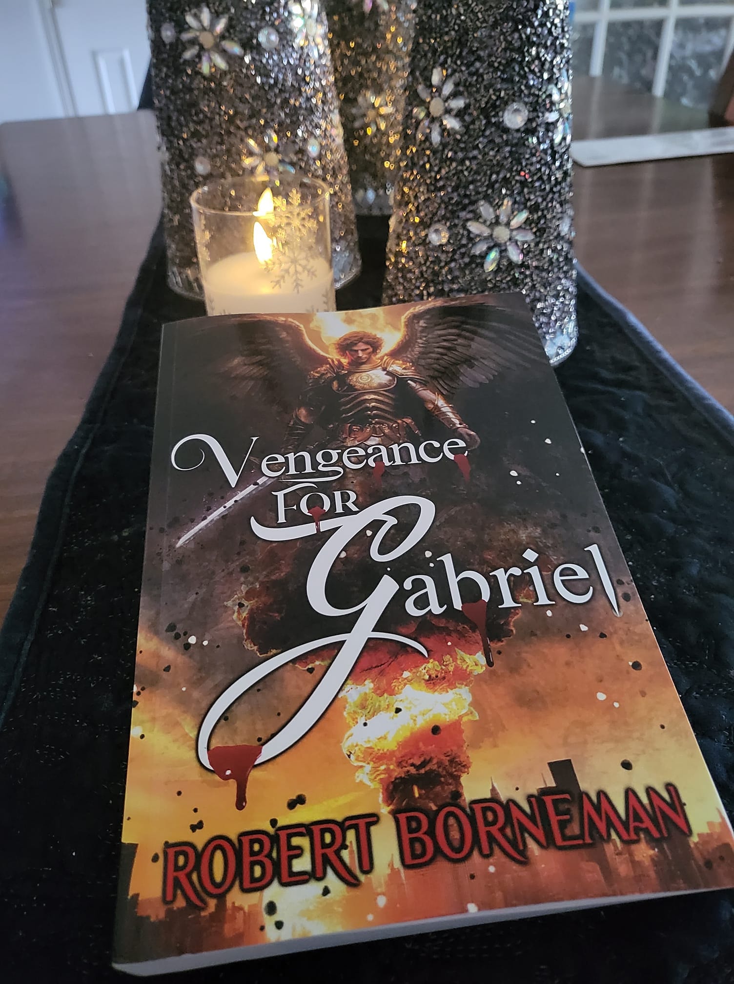 Anne Line with Vengeance for Gabriel displayed with candles