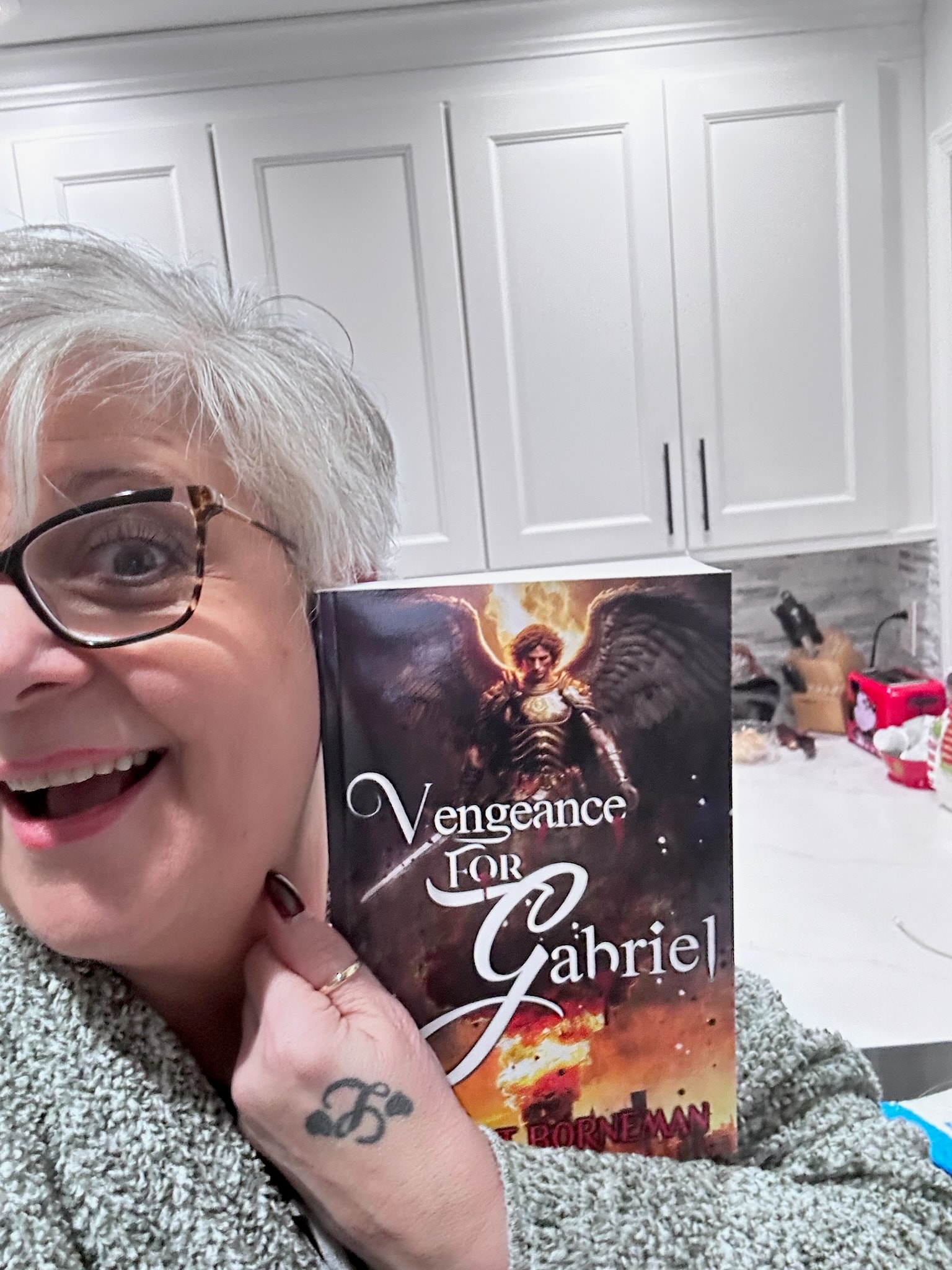 Reader holding Vengeance for Gabriel